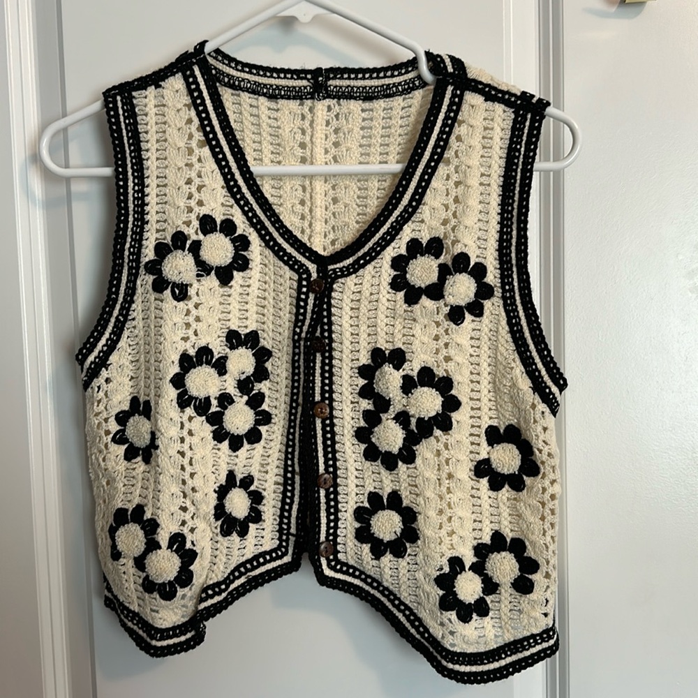 Knit sweater vest.